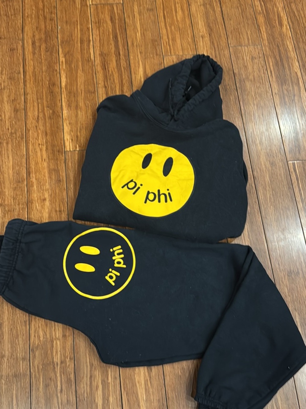 Pi Phi Black sweatsuit with Yellow Graphic smiley face Detail